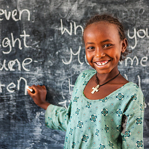 istock African little girl is learning English language 484511244