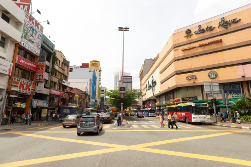 Kuala Lumpur, Malaysia - November 26, 2013: people and cars traffic on the streets of Jalan P. Ramlee district in Kuala Lumpur
