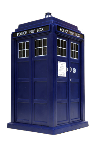 Vancouver, Canada - February 17, 2014: A toy TARDIS from Dr. Who, against a white background. The TARDIS is the Doctor's main form of travel, a time machine and spaceship that is larger on the inside. Doctor Who is created by the BBC.