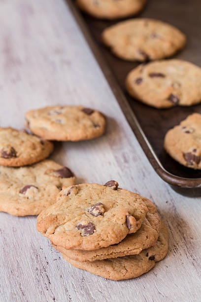 istock Chocolate Chip Cookies In A Row and On Cookie Sheet 484516769