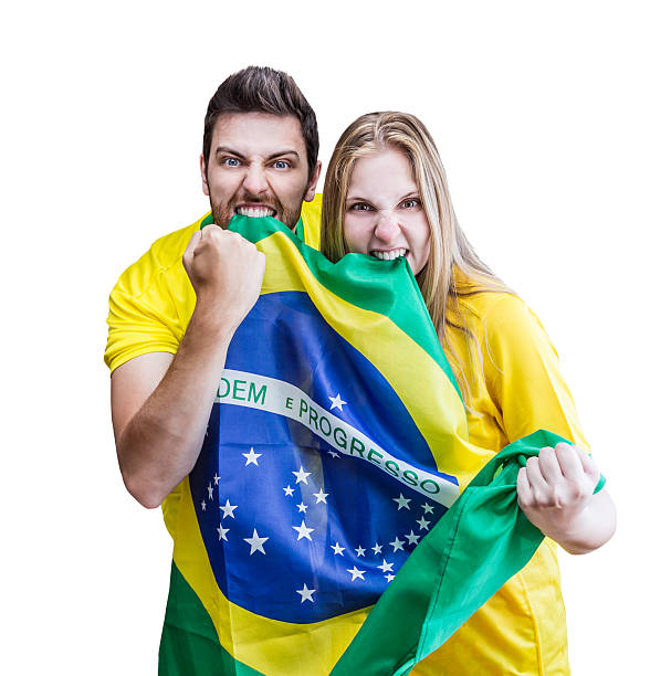 istock Brazilian fans celebrate on white background 484517359