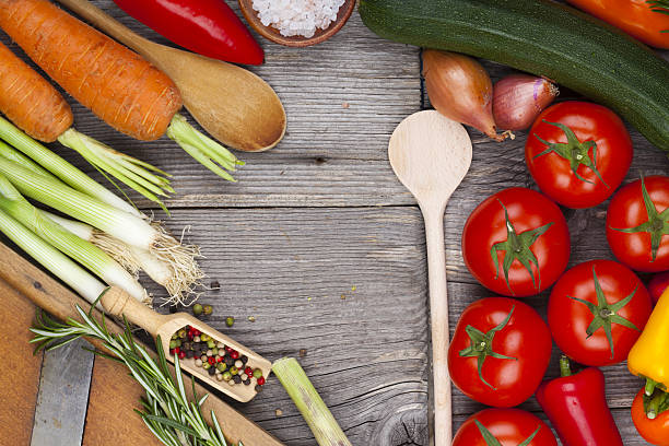 istock Vegetables, herbs and spices on wooden board 484517373