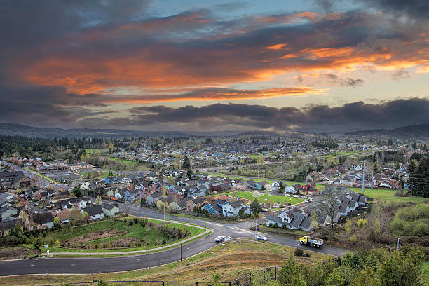 istock Cloudy Sunset Over America Suburban Residential Town 484517415