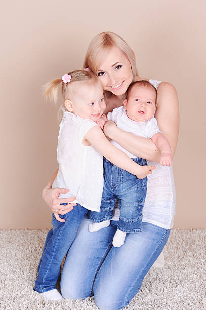 istock Happy mother holding children 484517631