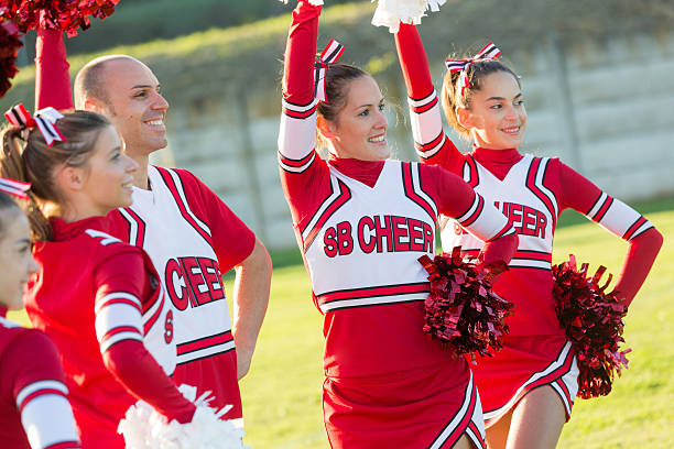 istock Group of Cheerleaders in the Field 484518039