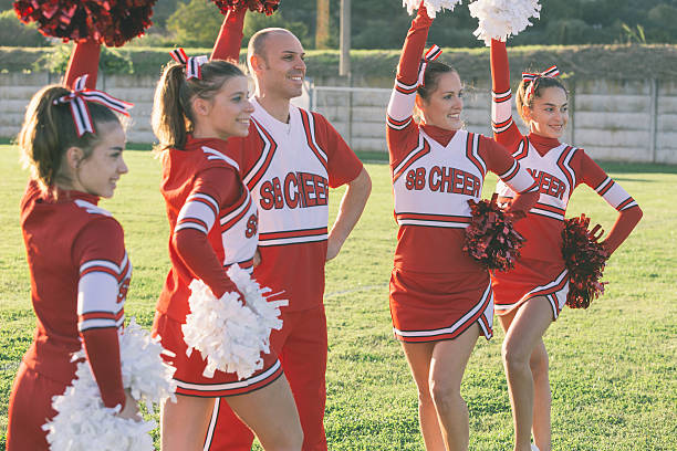 istock Group of Cheerleaders in the Field 484518041