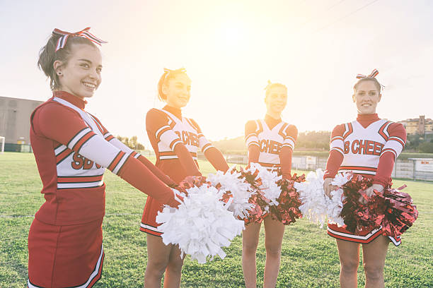 istock Group of Cheerleaders in the Field 484518043