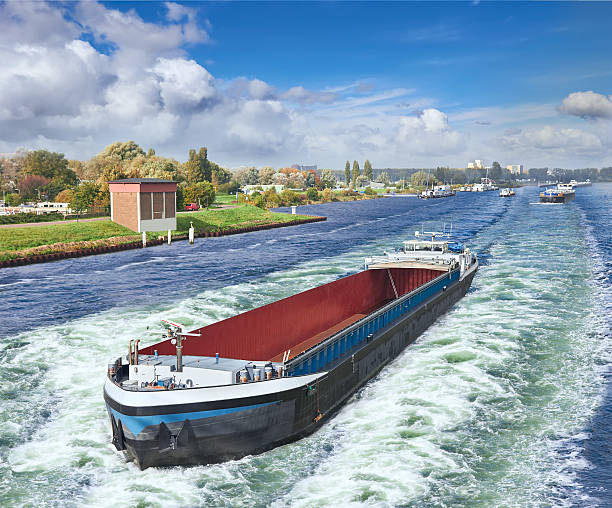 Barge on the Amsterdam in summer day stock photo