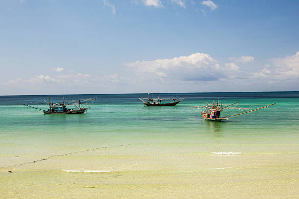 istock Fishing boats moored in beach 484521119