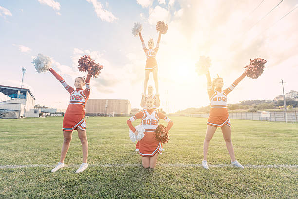 istock Group of Cheerleaders in the Field 484521521