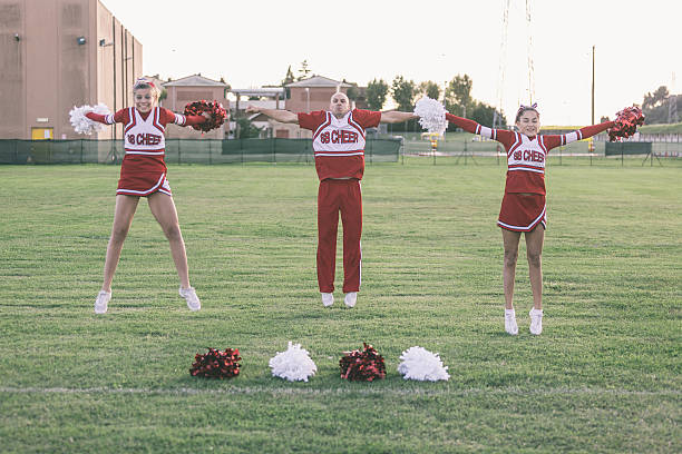 istock Group of Cheerleaders in the Field 484521539