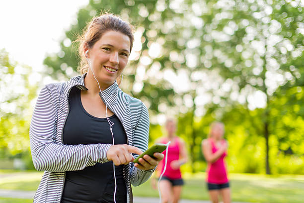 istock listening to music helps her workout 484522153