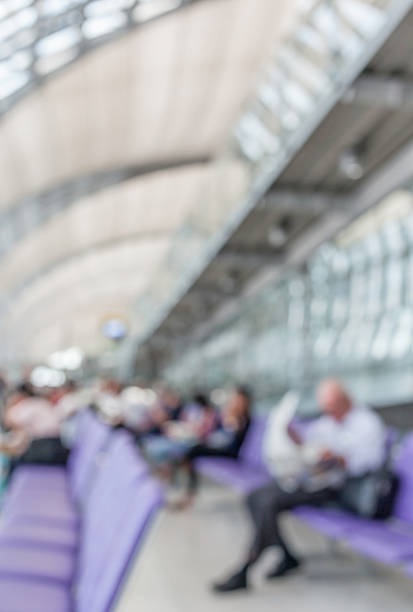 istock Blurred image of man read newspaper while waiting the flight. 484522670