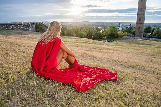 Resting superhero, blonde wonderwoman posing outdoor