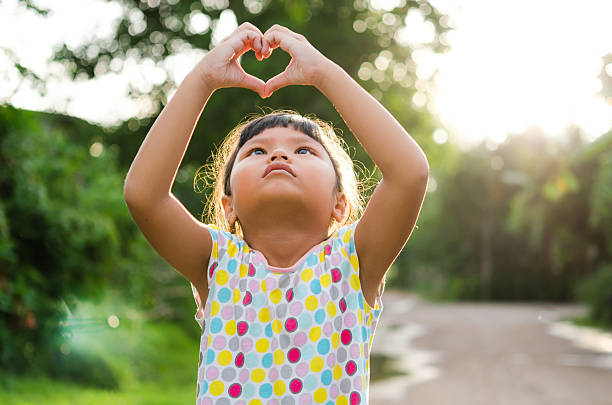 istock children look pass hand heart 484525898