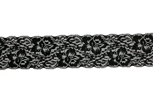 Black lace on white background.