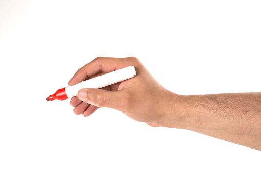 male hand is ready for drawing with red marker. Isolated on white.