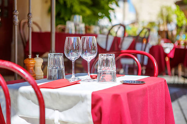 istock Street view of a cafe terrace with empty tables 484527672