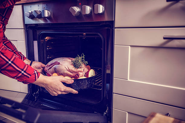 istock Preparing Traditional Holiday Goose with Side Dishes 484530466