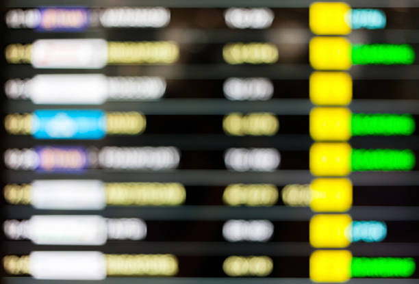 istock High key blurred image of Departure and arrivals electronic schedule. 484534128