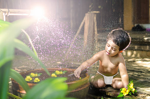 in outdoor nature in hot summer daylight wearing baby diaper