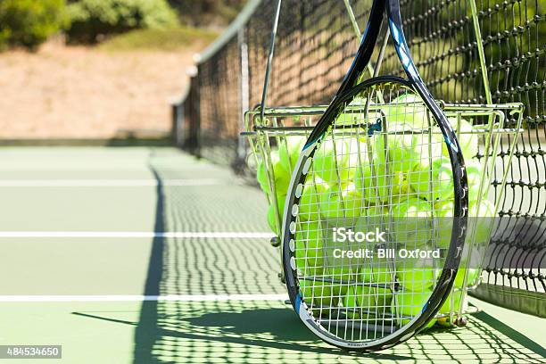 Tennis Balls And Racquet On Court Stock Photo - Download Image Now - Tennis, Equipment, 2015