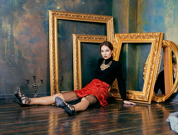 istock beauty rich brunette woman in luxury interior near empty frames 484537620