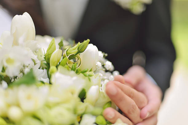 istock Wedding rings on a bouquet 484537835