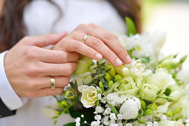 Wedding Couple hands on wedding, symbolise forever togetherness and marriage. hands of bride and bridegroom in wedding marriage ceremony stock pictures, royalty-free photos & images