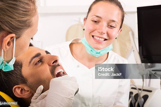 Patient Reception At Dentist Stock Photo - Download Image Now - 2015, 25-29 Years, Adult