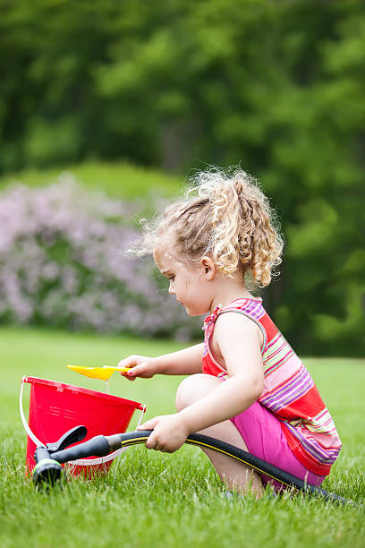 istock Girl Playing With Water 484539611