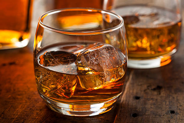 istock Alcoholic Whiskey Bourbon in a Glass with Ice 484539867