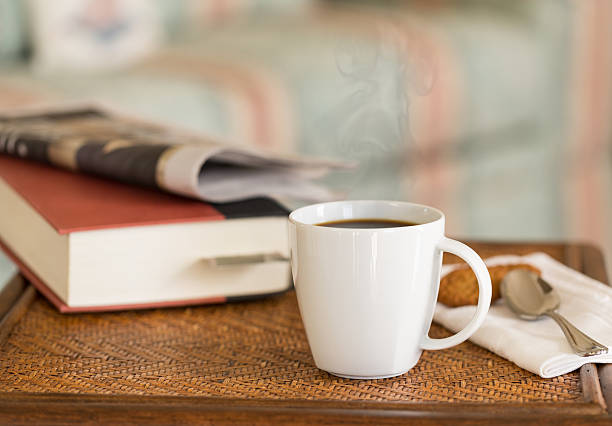 istock Black coffee in white mug wooden table 484540071