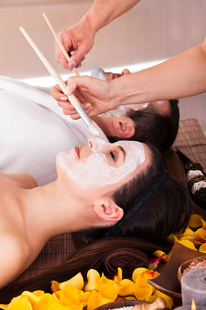 istock Couple With Face Mask In Spa Centre 484540430