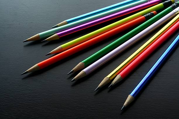 istock Colored pencils on a wooden table 484540854
