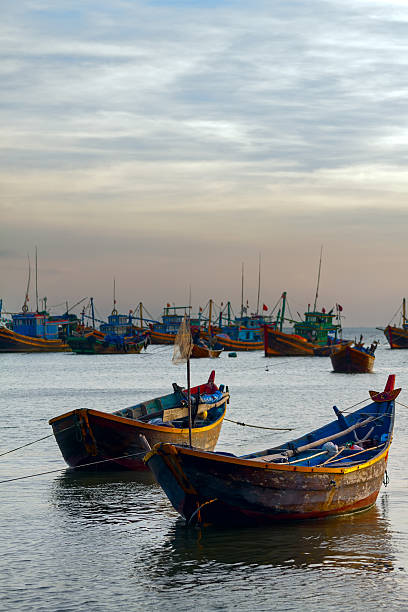 istock wooden boat sunset 484540889