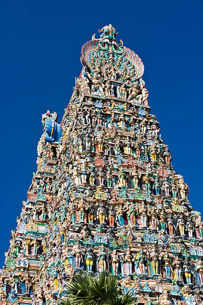 The Meenakshi Amman Temple In Madurai, India The Sri Meenakshi Temple in Madurai, India is an ancient temple built in the 1600's.  This is one of the famous gopurams. menakshi stock pictures, royalty-free photos & images