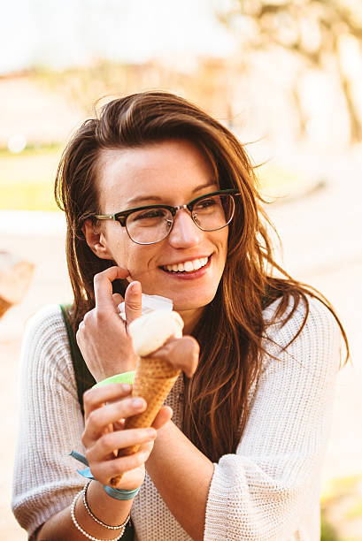 istock group of friends eating icecream on summer 484541571