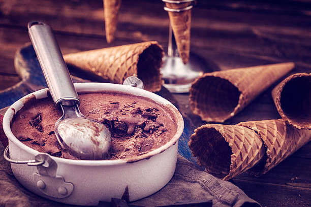 Delicious Homemade Chocolate Ice Cream Delicious Homemade chocolate Ice Cream. This frozen dessert is made from dairy products, such as milk and cream. They can be combined with fruits and other ingredients and flavour. homemade icecream stock pictures, royalty-free photos & images