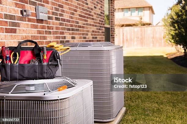 Service Industry Work Tools Air Conditioners Outside Residential Home Summer Stock Photo - Download Image Now