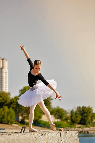 istock Ballerina dancing on the waterfront. 484541910