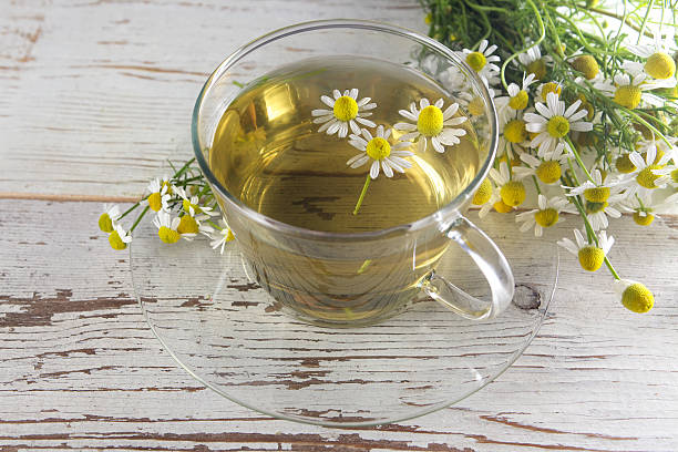 istock cup of chamomile tea with flowers 484544948