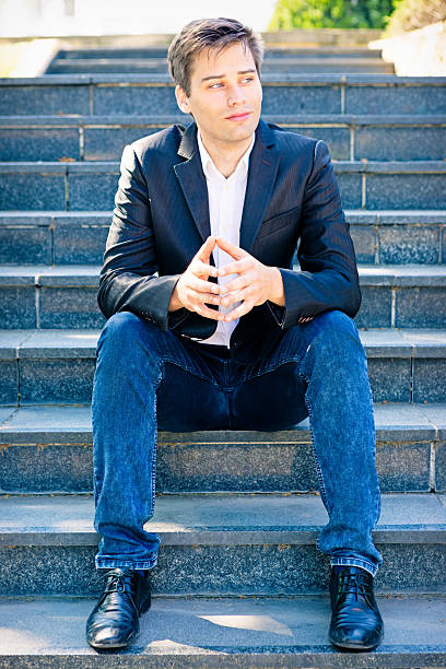 istock Businessman sitting on a staircase 484545628