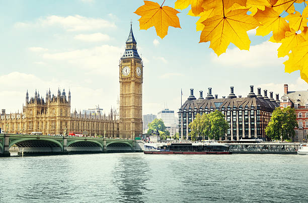 istock autumn leaves and Big Ben, London 484546028