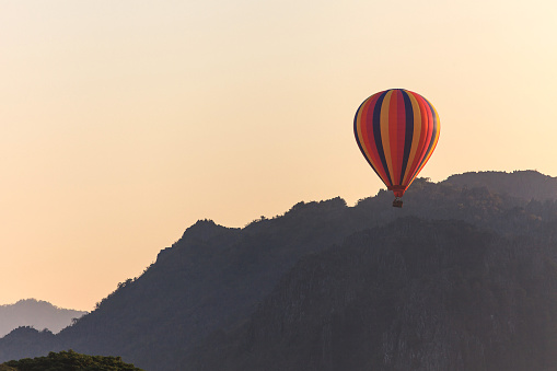 Hot air balloon over mountain, Vang Vieng, Laos