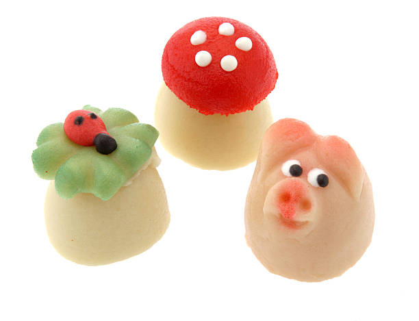 Marzipan is a confection consisting primarily of sugar and almond meal. Persipan is a similar, yet less expensive product, in which the almonds are replaced by apricot or peach kernels. Many confectionery products sold as marzipan are made from less expensive materials, such as soy paste and almond essence.  In Portugal, where the confection has been made by nuns since olden times, traditional marzipan (maçapão) fruit shaped sweets made in the Algarve region are called morgadinhos.