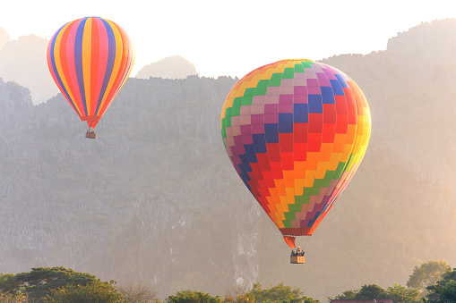 Hot air balloon over mountain, Vang Vieng, Laos