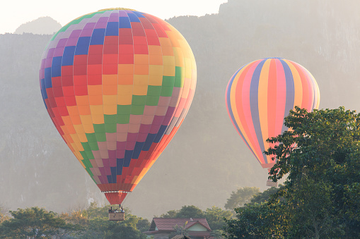 Hot air balloon over mountain, Vang Vieng, Laos