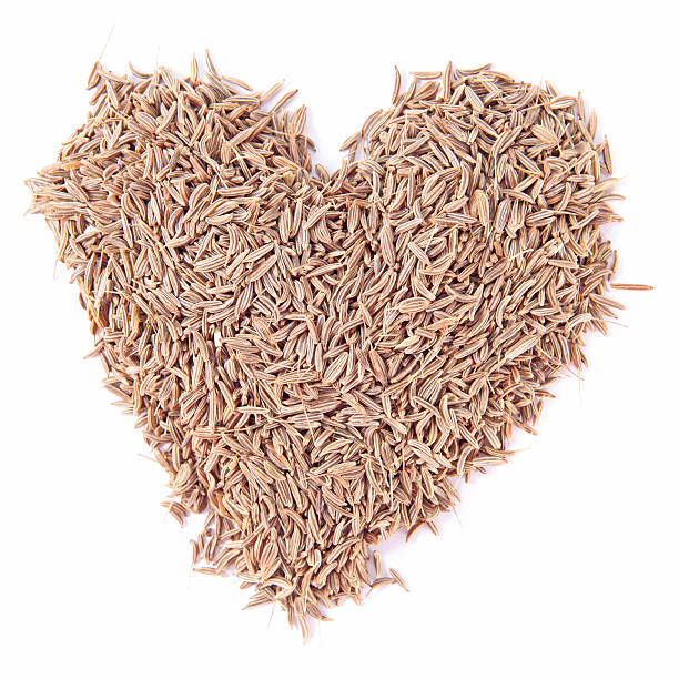 istock cumin seeds heart  isolated on white background 484551580