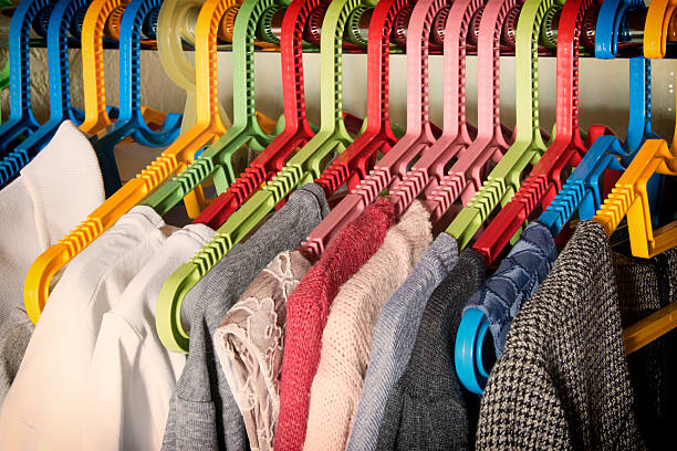 istock colorful clothes on hangers in the wardrobe 484551926